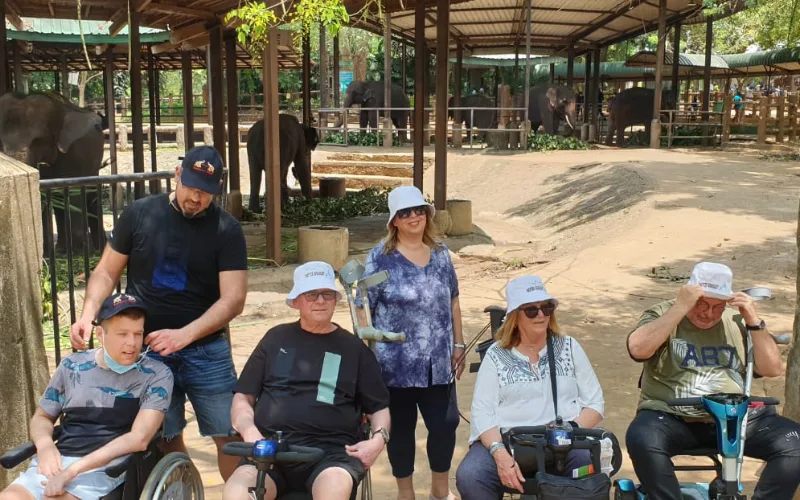 Travellers using wheelchairs watching elephants on an accessible Sri Lanka nature visit