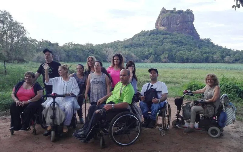 Travellers using wheelchairs on an accessible Sri Lanka tour at Sigiriya Rock